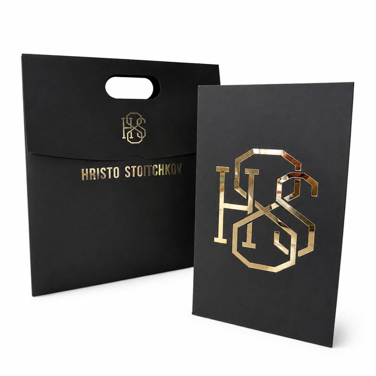 Black H8S collector's box for a cast of Hristo Stoitchkov's left foot, with a monogram and matching branded bag.