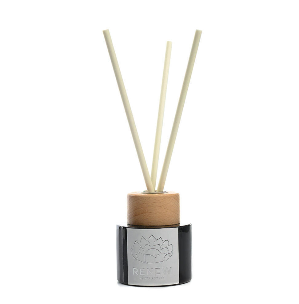 RENEW fragrance diffuser with a wooden cap and personalised brand label.